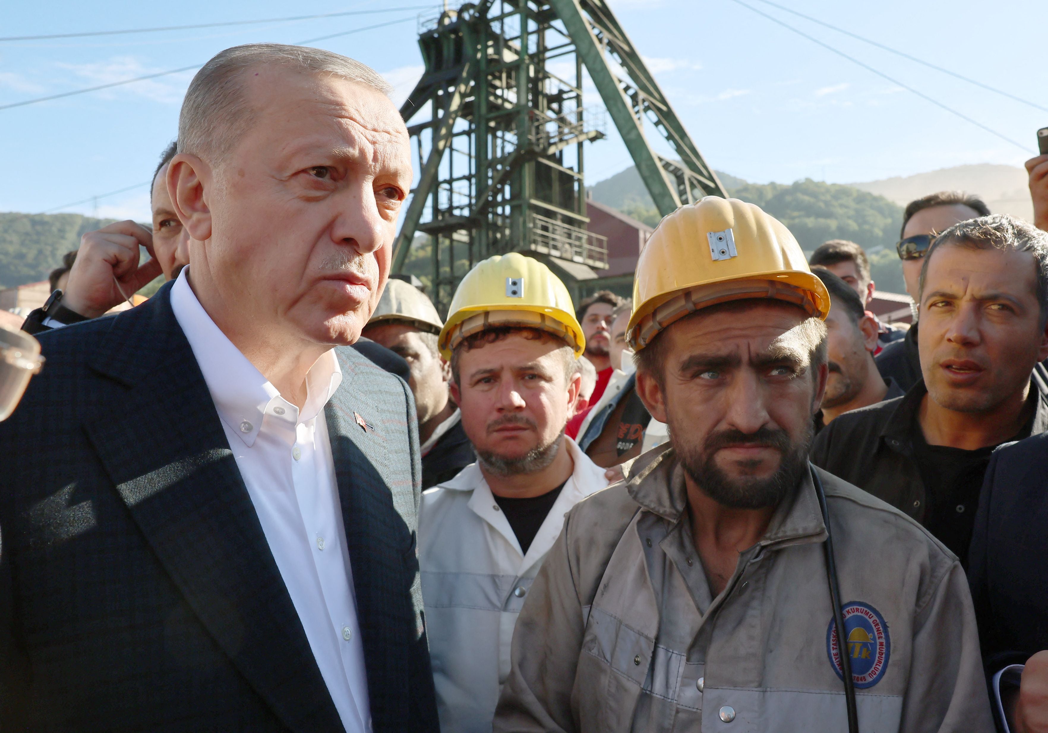 Turkish President Recep Tayyip Erdogan meets miners at the scene of the deadly explosion