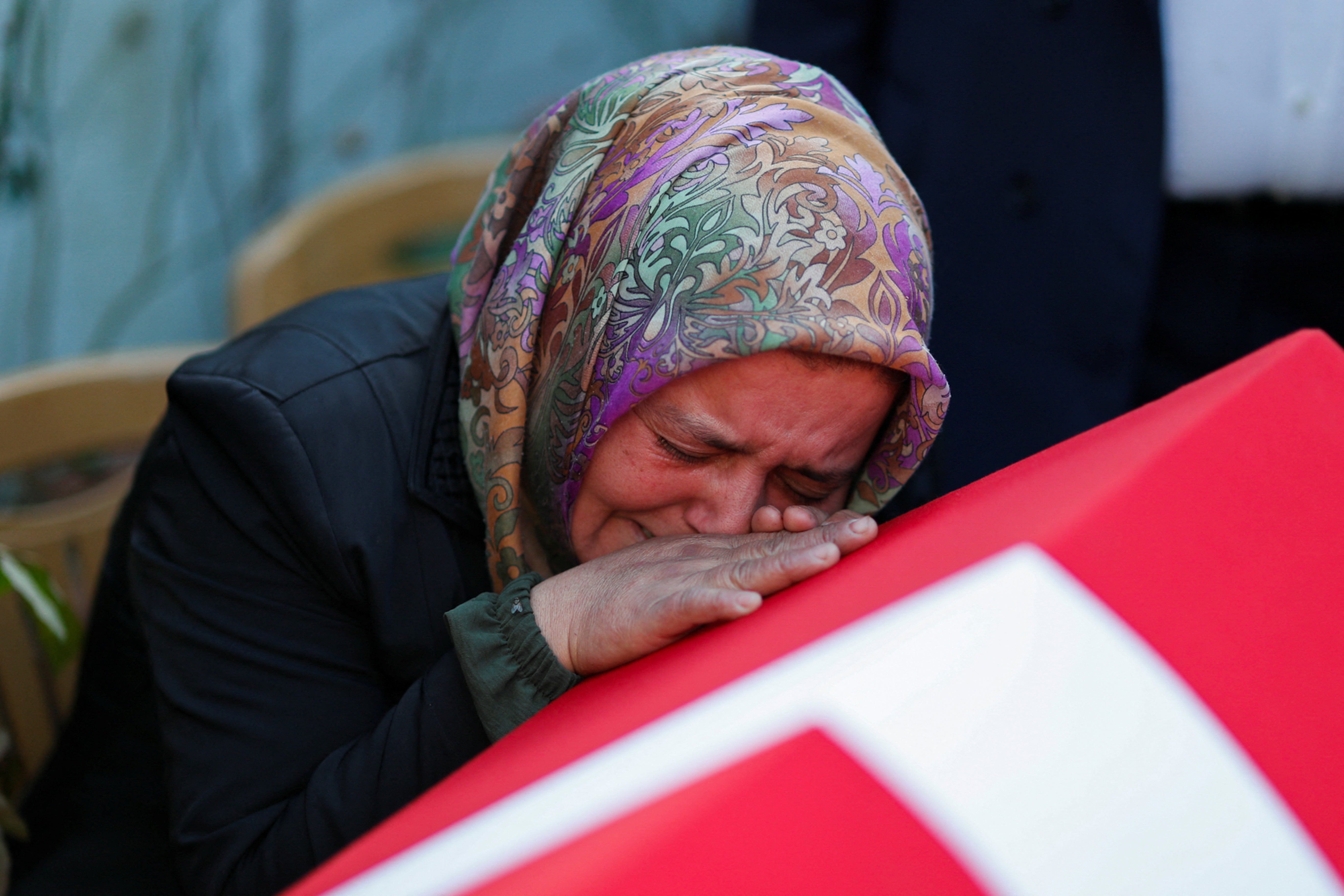 A relative mourns mine blast victim Ridvan Acet in Kazpinar Bartin province, Turkey on Saturday