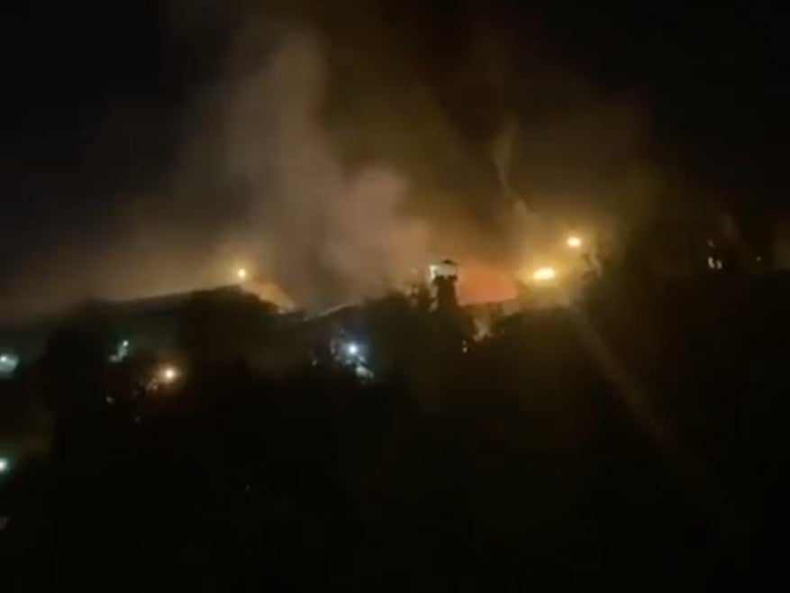 Footage captures the sound of shooting and flames billowing from the site of the prison