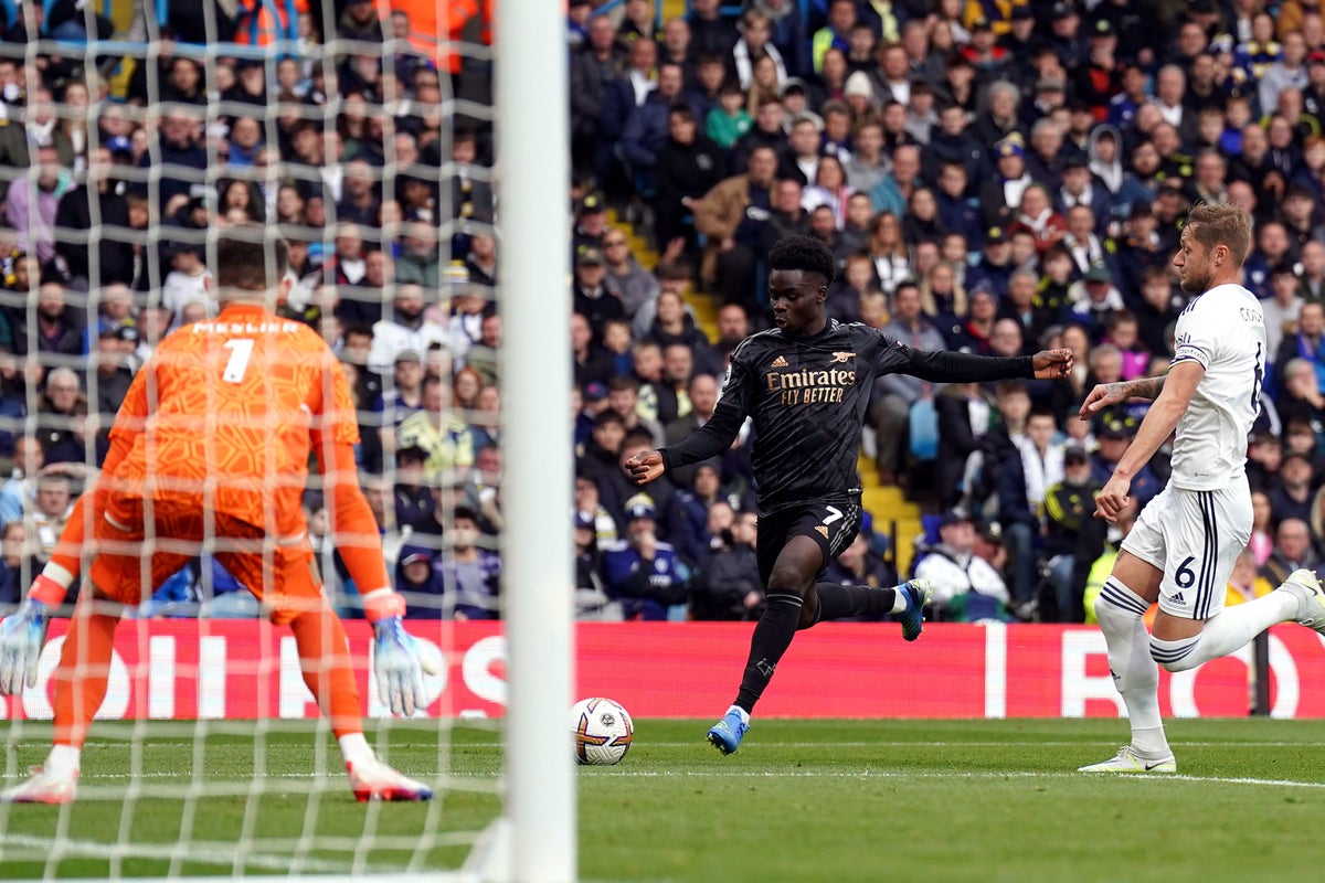 Bukayo Saka fires Arsenal to win as league leaders survive late scare at Leeds