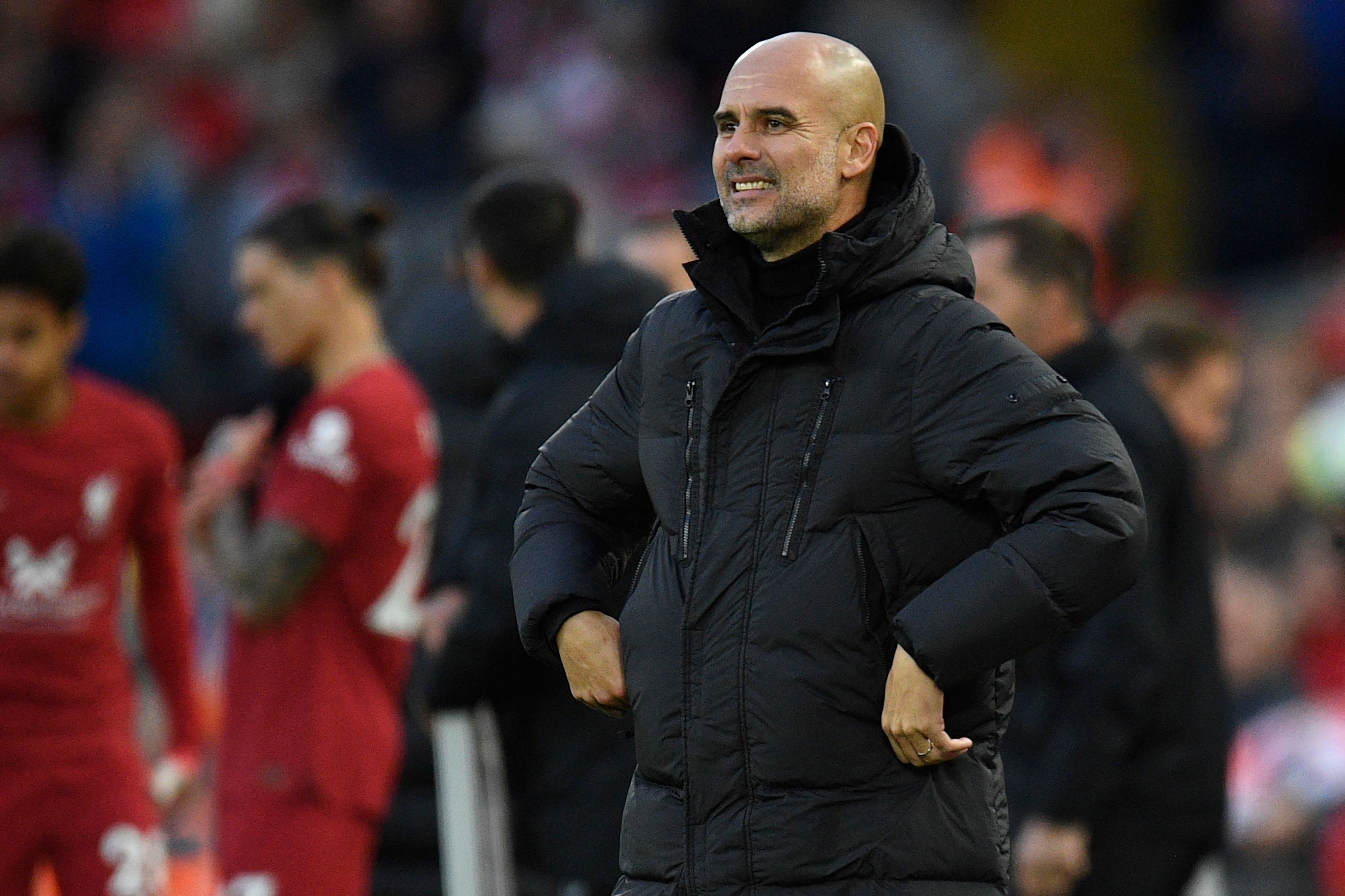 Guardiola cuts a frustrated figure on the touchline at Anfield on Sunday