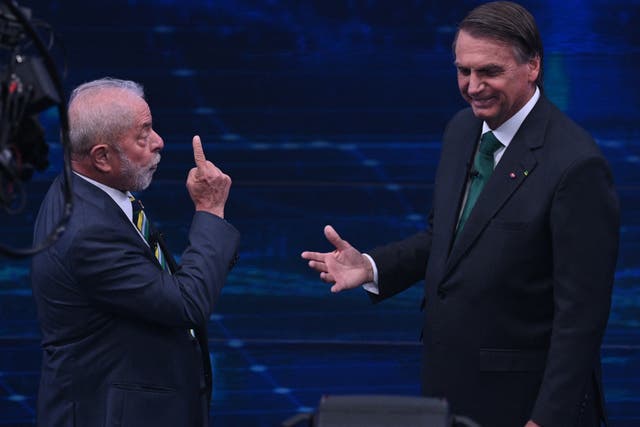 <p>Luiz Inacio ‘Lula’ da Silva gestures at Jair Bolsonaro during the debate</p>