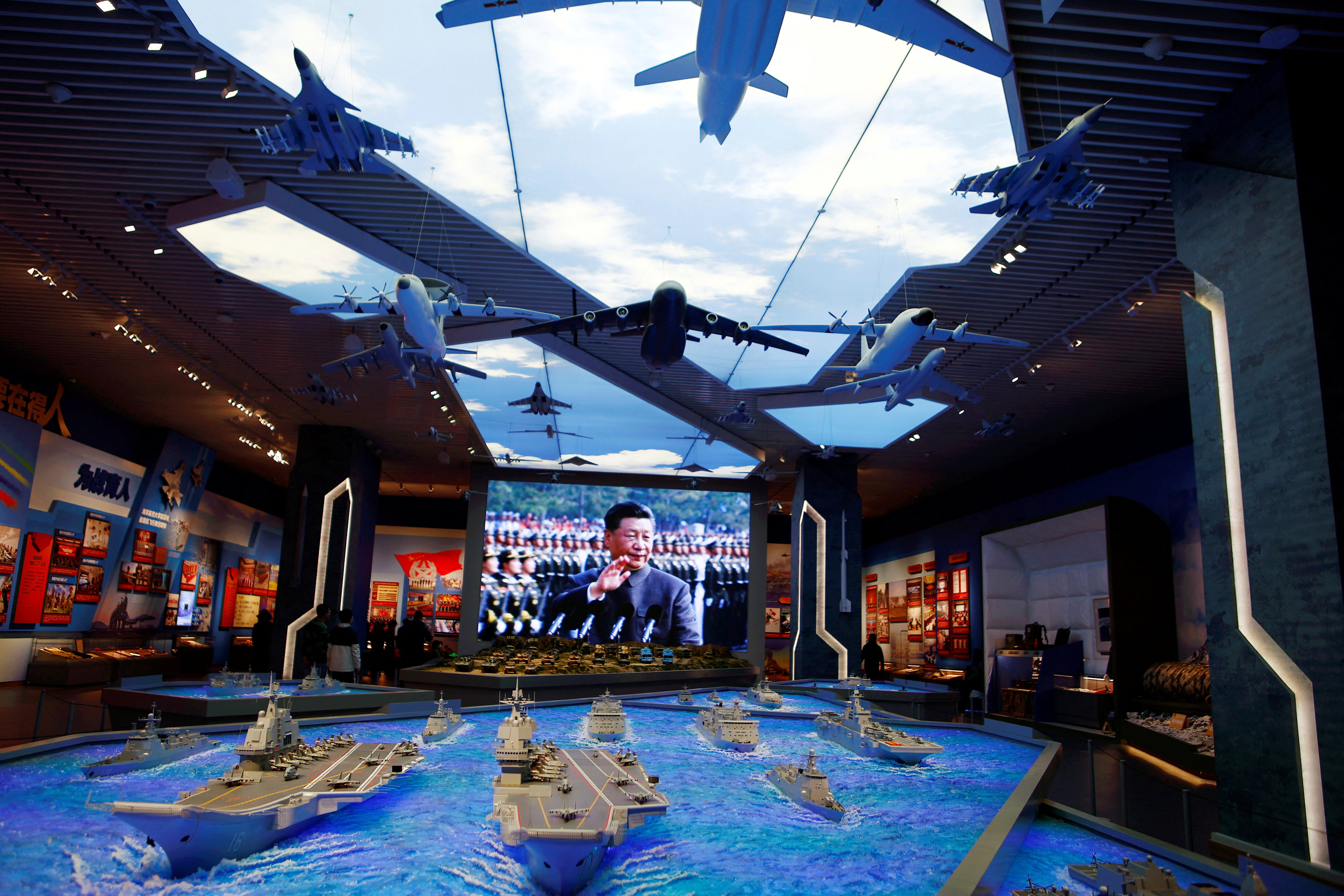 Models of military equipment and a giant screen displaying Chinese president Xi Jinping feature in an exhibition at the Military Museum of the Chinese People’s Revolution in Beijing