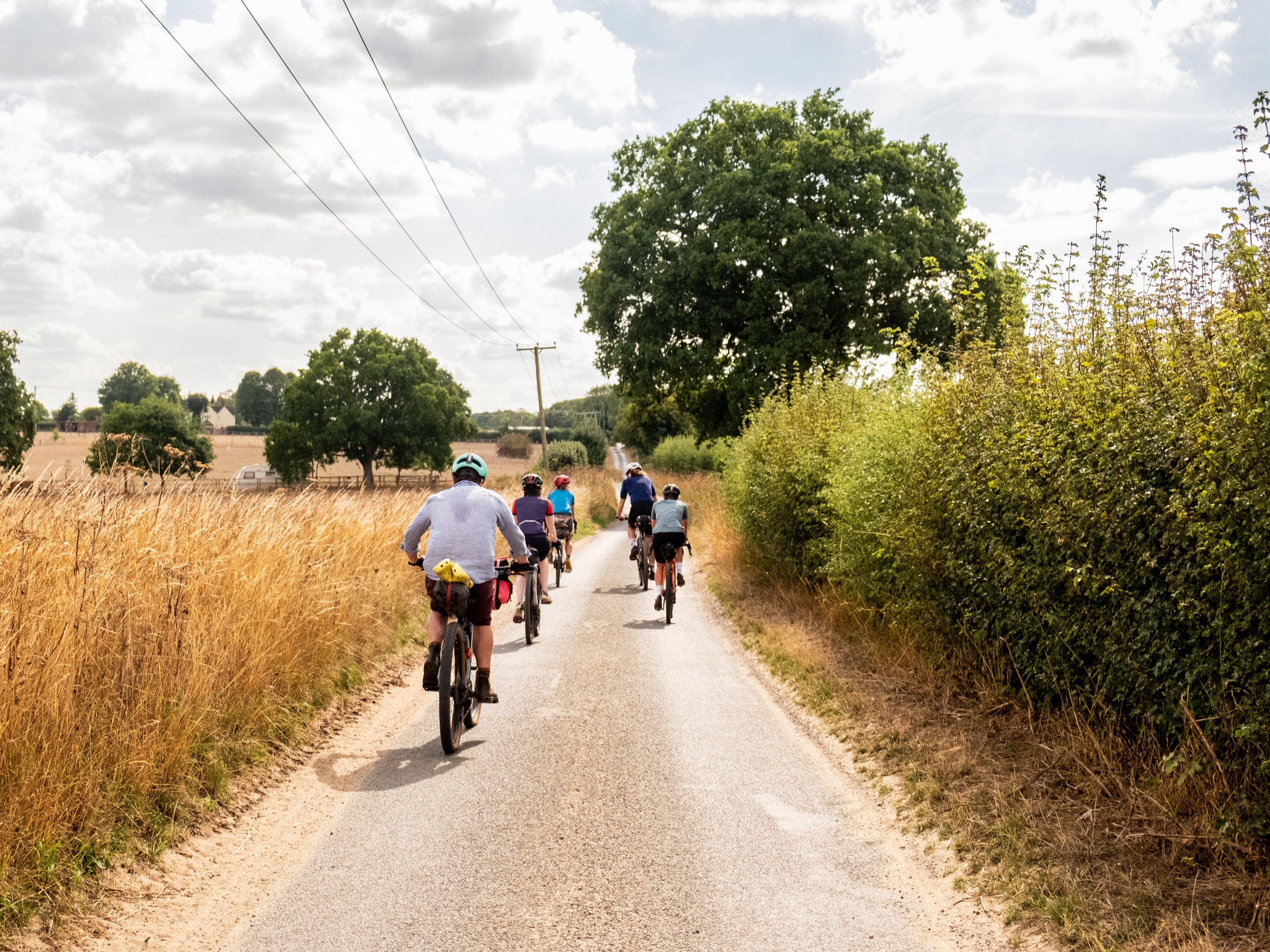 <p>Cyclists ride down one of the quiet ways making up Norfolk’s Rebellion Way </p>