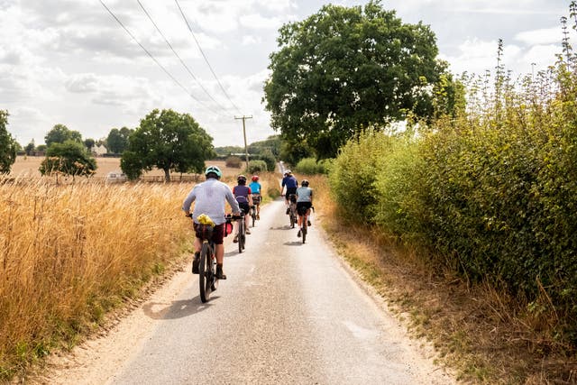 <p>Cyclists ride down one of the quiet ways making up Norfolk’s Rebellion Way </p>