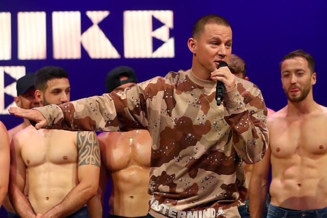 <p> Channing Tatum appears on stage with Magic Mike Live dancers during a media call on December 03, 2019</p>
