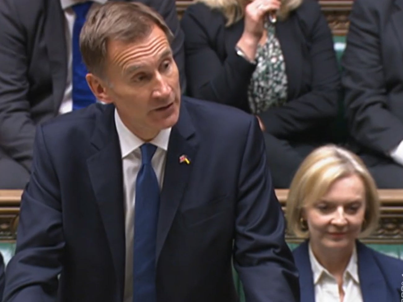 Liz Truss sits beside her chancellor as he speaks in the Commons on Monday