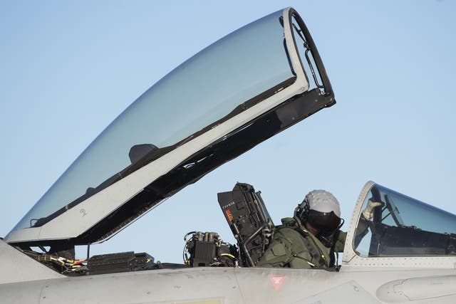 <p>FA Royal Air Force pilot prepares his Eurofighter Typhoon aircraft</p>