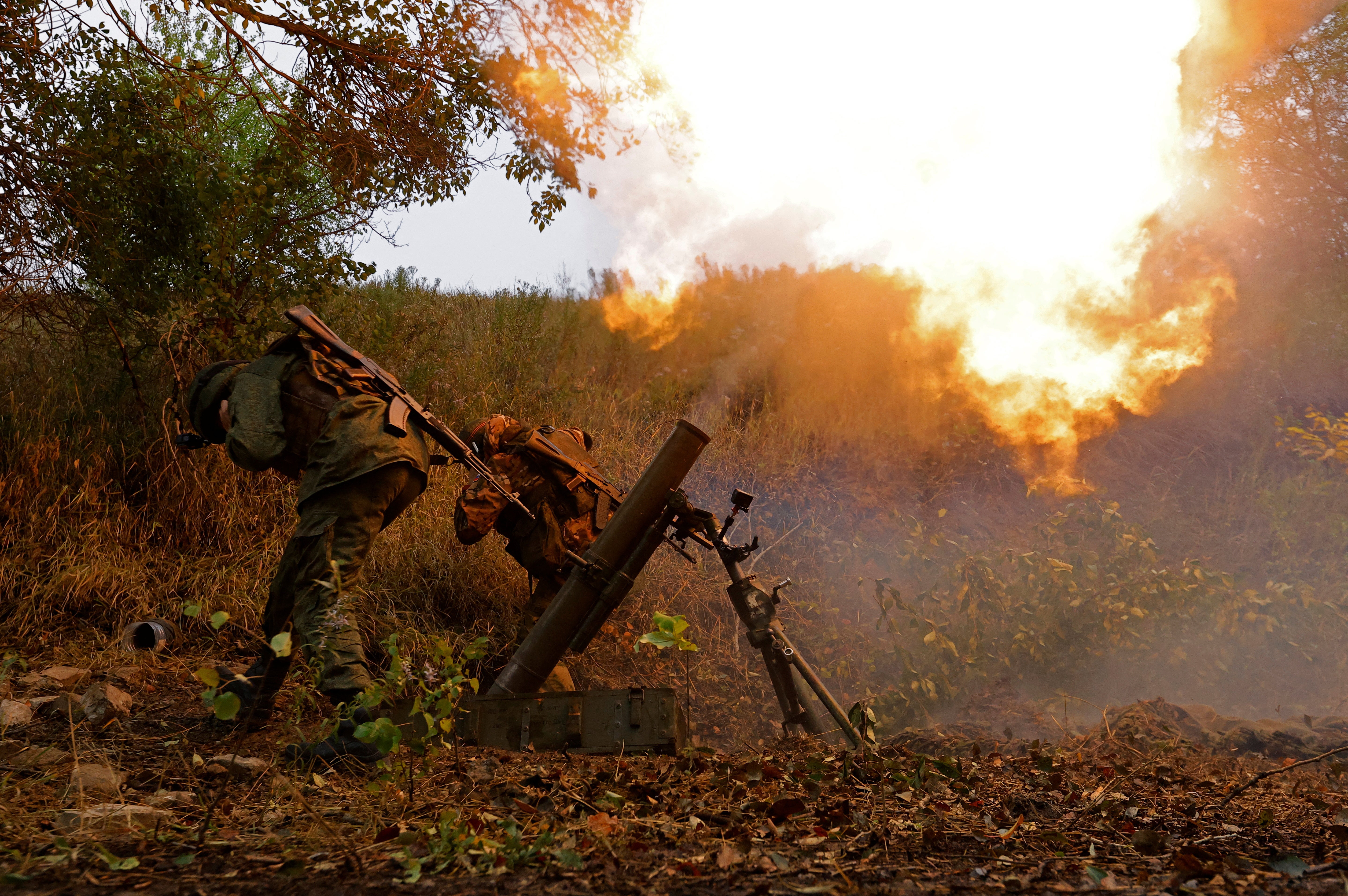 Separatist pro-Russian troops fire a mortar towards Avdiivka in this photograph from September