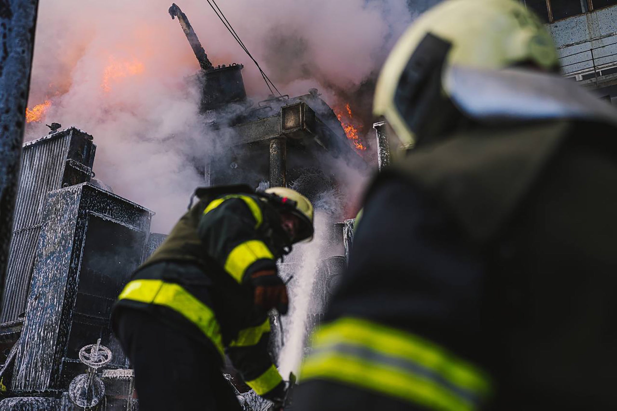 Emergency services responding to a fire after shelling in Kyiv