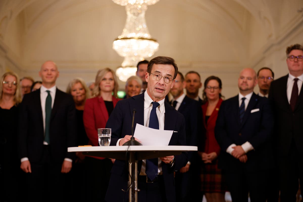 New Swedish PM presents 3-party government New Swedish PM presents 3-party government