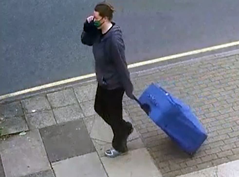 <p>A CCTV image of Jemma Mitchell dragging a blue suitcase in northwest London on 11 June 2021 (Metropolitan Police/PA)</p>