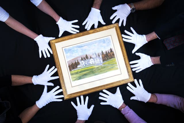 A signed limited-edition print of a watercolour featuring Balmoral Castle by the King at Bonhams in Edinburgh (Jane Barlow/PA)