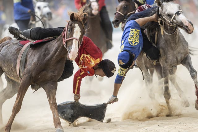 <p>Horseriders of Kazakhstan and Kyrgyzstan compete during the Kok boru final</p>