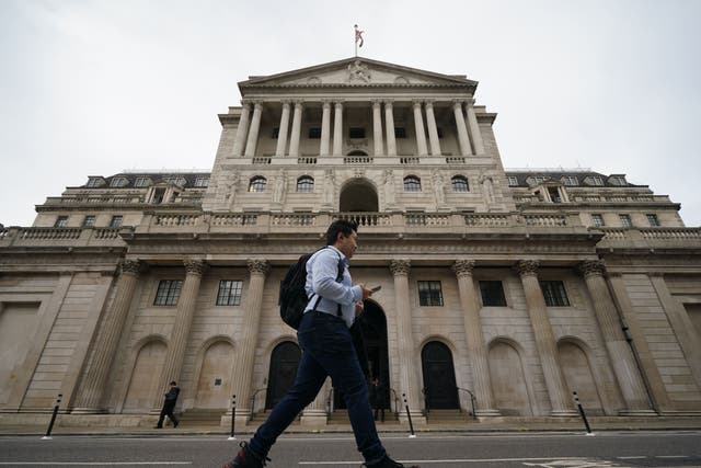 A man walks past the Bank of England in the city of London. The central bank has said it will start selling government bonds from November 1 (Yui Mok/PA)