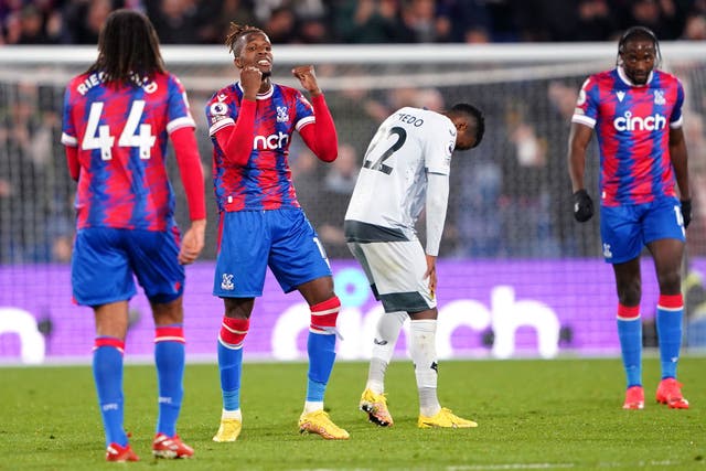 Wilfried Zaha, second left, celebrates victory over Wolves (Zac Goodwin/PA)