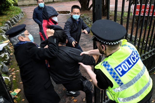 <p>The moment when a protester was dragged into the Chinese consulate</p>