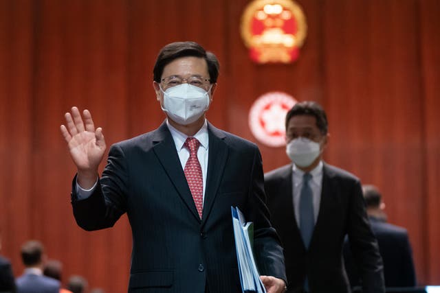 <p>Hong Kong chief executive John Lee leaves the chamber after delivering his policy address at the Legislative Council on 19 October 2022 in Hong Kong</p>