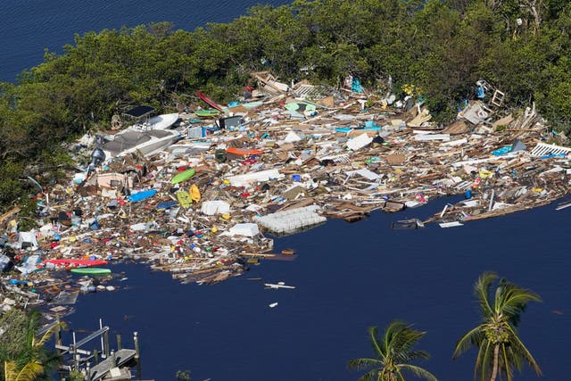 <p>Debris is piled up at the end of a cove following heavy winds and storm surge caused by Hurricane Ian in Florida on September 29</p>