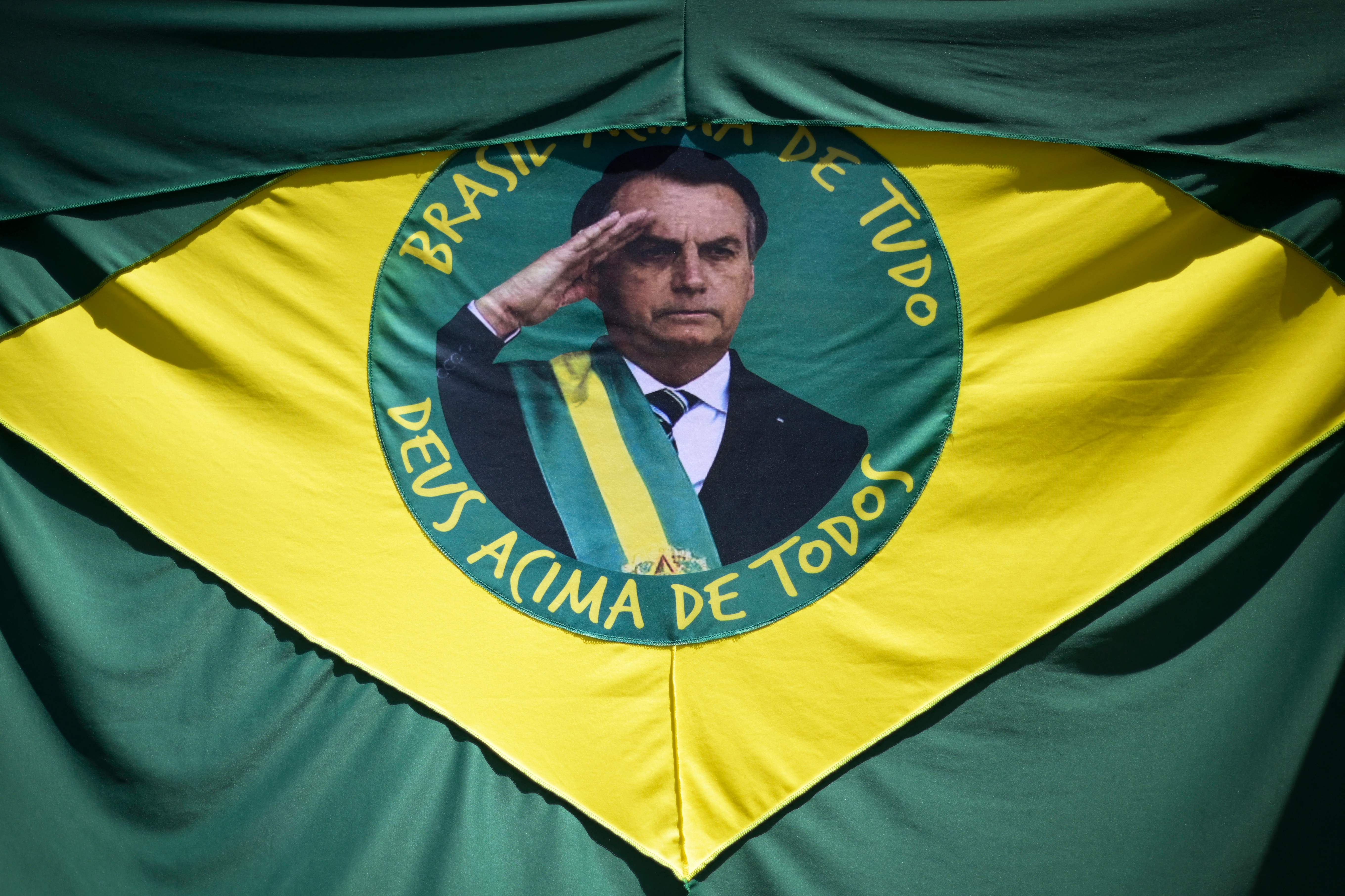 A Brazilian flag with the face of Brazil’s President Jair Bolsonaro