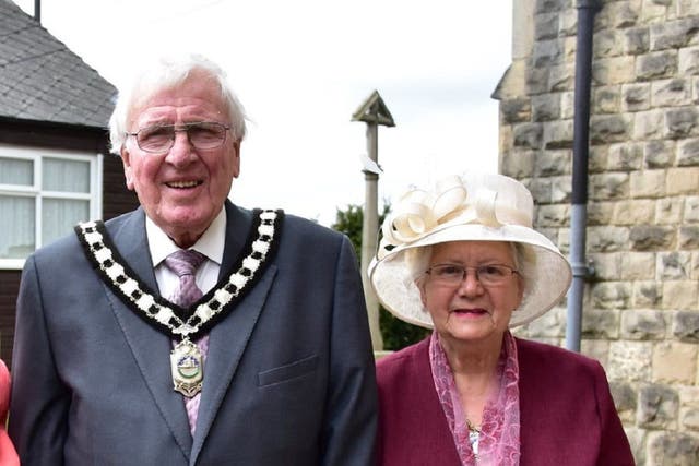 Former district councillor Ken Walker with his wife Freda (PA)