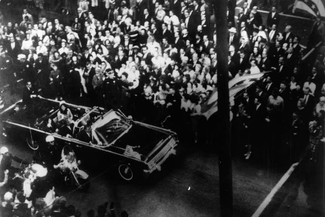 <p>US statesman John F Kennedy, 35th president of the US, and his wife Jackie Kennedy travelling in the presidential  motorcade at Dallas, before his assassination</p>