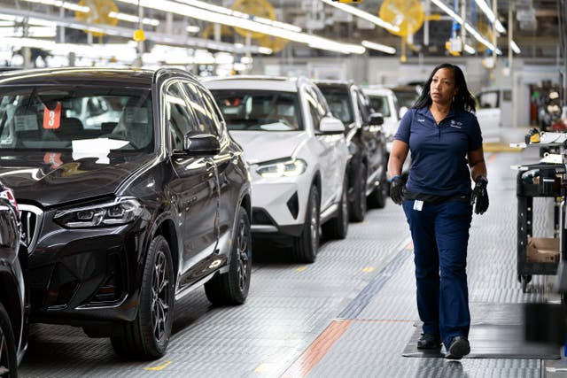 <p>An employee works in the X3, X45 assembly hall at the BMW Spartanburg plant </p>