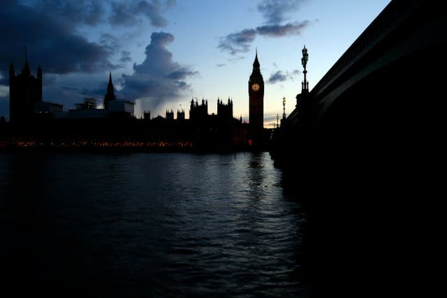 <p>The sun sets behind the Palace of Westminster, London (Jonathan Brady/PA)</p>