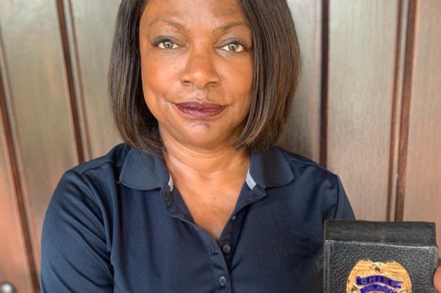 <p>Congresswoman Val Demings, who is running a Senate seat in Florida, shows off her Orlando Police Department badge. She served as chief of the police department for five years</p>