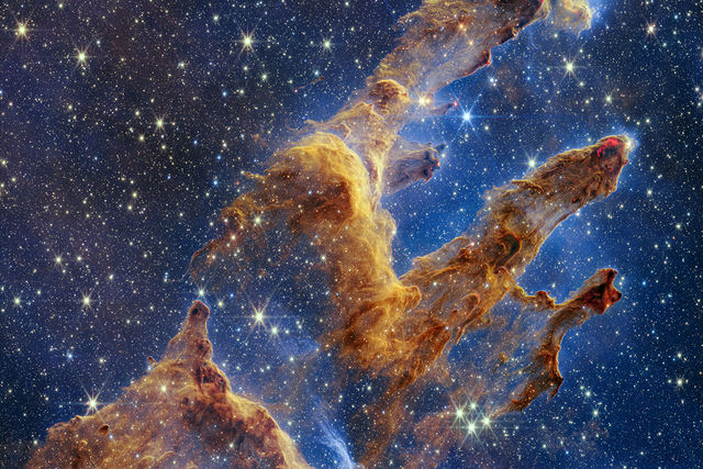<p>The Pillars of Creation, a region of new star formation within the Eagle Nebular, as imaged by the James Webb Space Telescope</p>