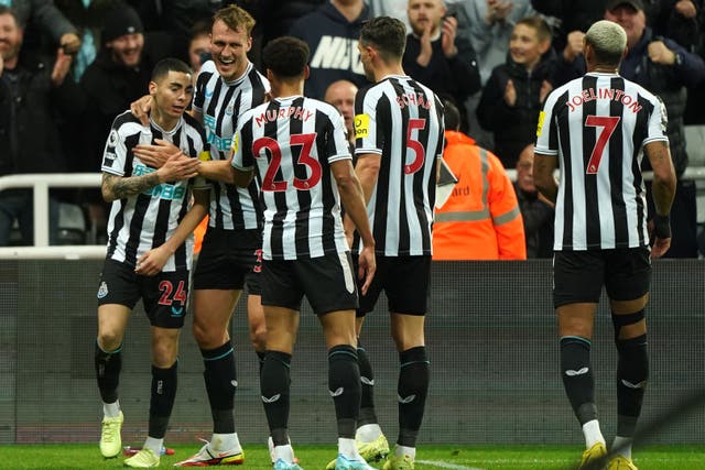 Miguel Almiron (left) celebrates scoring Newcastle’s winner (Owen Humphreys/PA)