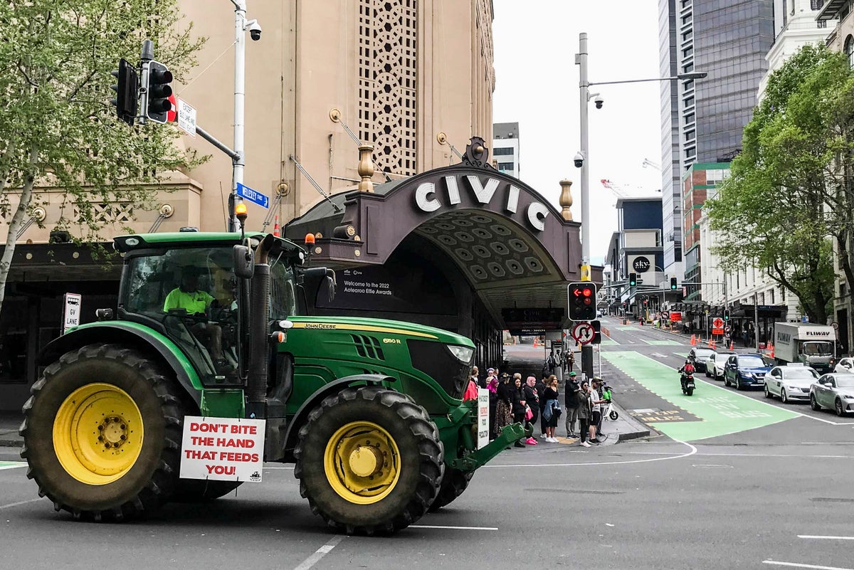 New Zealand farmers hit streets to protest cow-burp tax plan