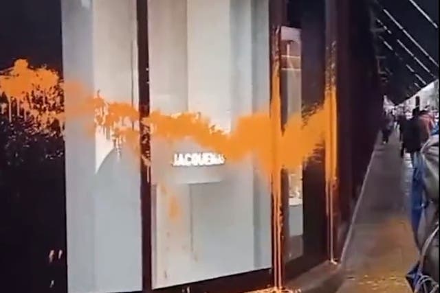 <p>Orange paint was sprayed on a window at Harrods </p>