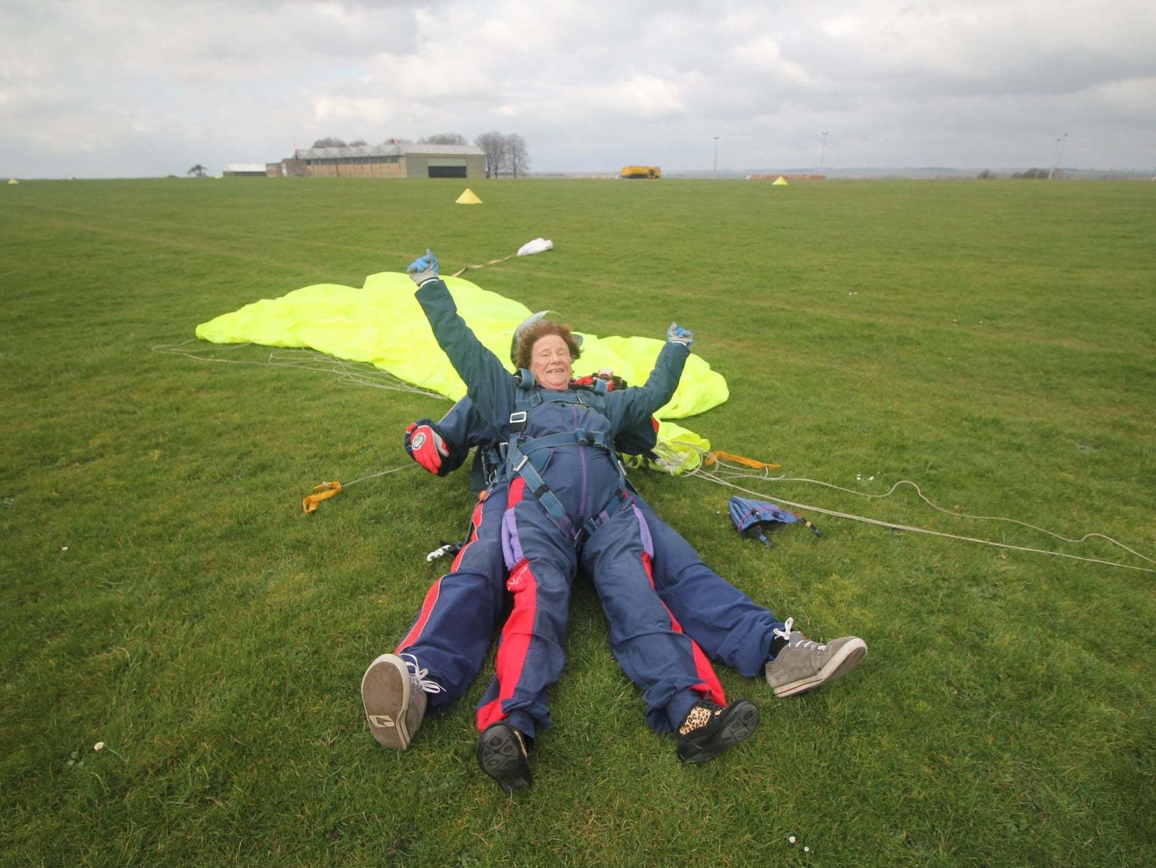 <p>Mercy Baggs after completing a parachute jump</p>
