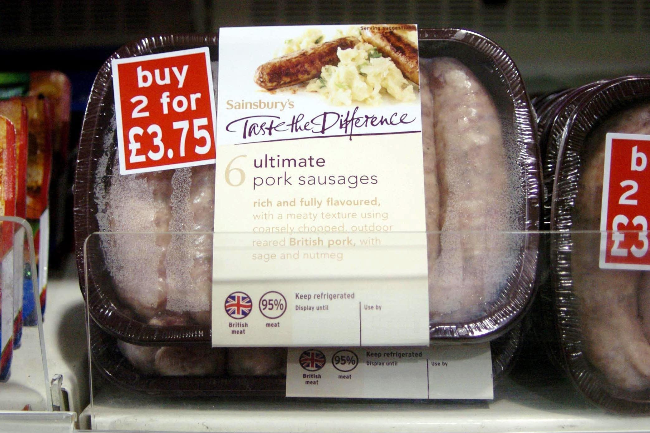 A packet of Sainsbury’s ‘Taste the Difference Ultimate Pork Sausages’, showing a use-by date (PA)