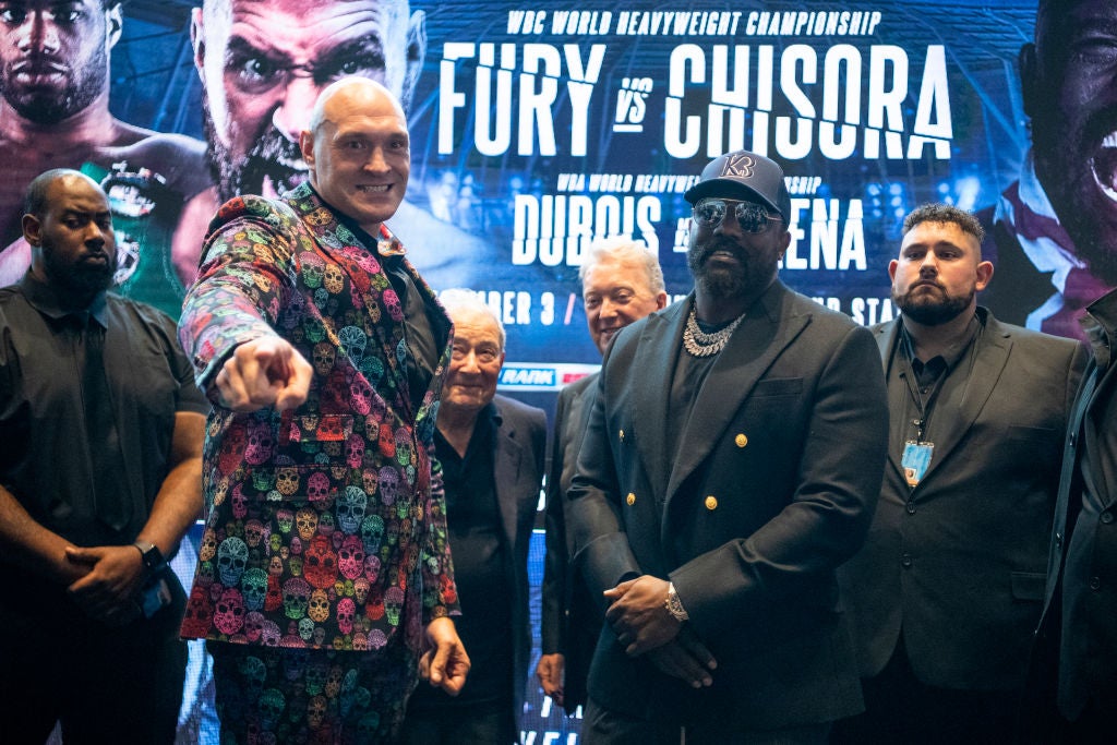 Tyson Fury (left) will fight Derek Chisora in December, having already beaten the veteran twice
