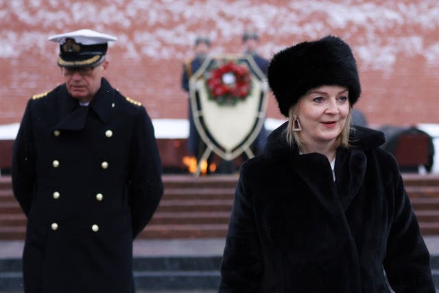 <p>Liz Truss takes part in a wreath-laying ceremony at the Tomb of the Unknown Soldier at the Kremlin in February</p>