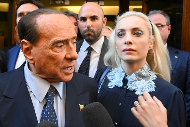 <p>Silvio Berlusconi, 86, and his girlfriend Marta Fascina, 32, following a meeting of his Forza Alliance party this week</p>