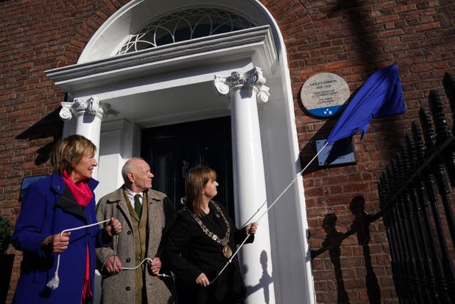 Lord Mayor Caroline Conroy (right), writer and producer Siobhan Lynam (left) and Councillor Mannix Flynn unveil a commemorative plaque for Dublin woman Violet Gibson at her childhood home on Merrion Square, Dublin (Brian Lawless/PA)