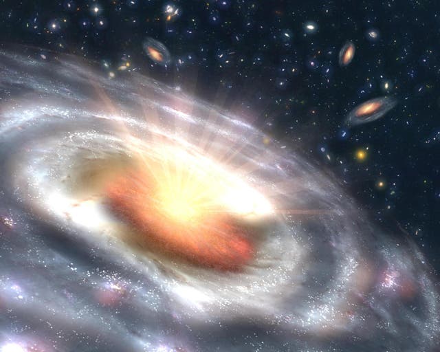 <p>An artist’s conception of a quasar surrounded by other galaxies</p>