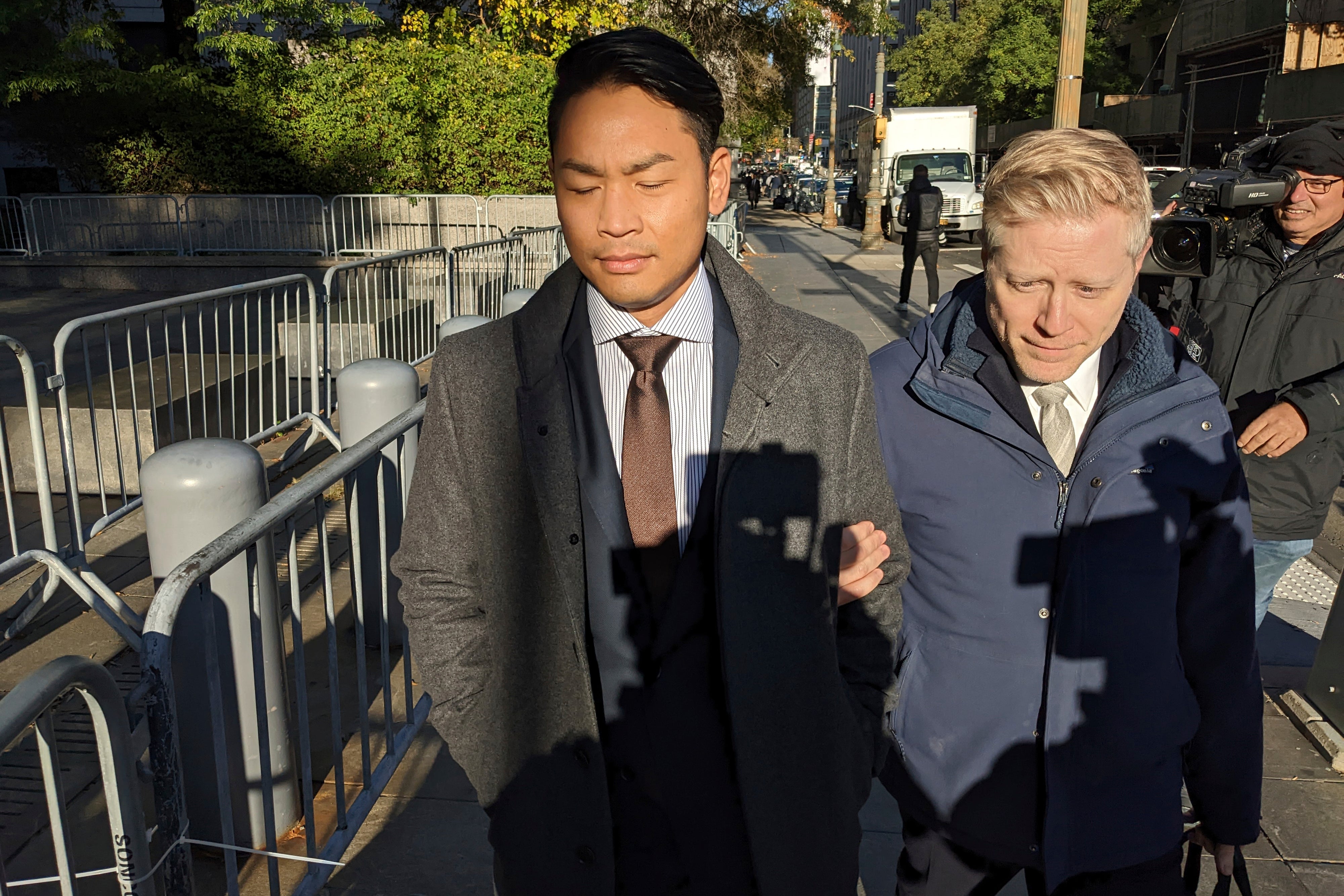 Actor Anthony Rapp, right, and his partner Ken Ithiphol arrive at the federal courthouse in lower Manhattan
