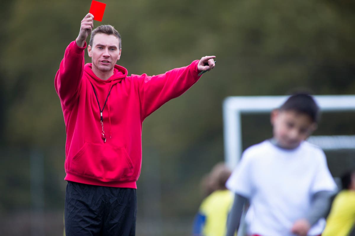 Who’d be a football ref when even kids are up for a ruck?