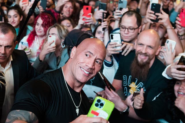 <p>Dwayne ‘The Rock’ Johnson poses with fans at the premiere of ‘Black Adam’ in Madrid</p>