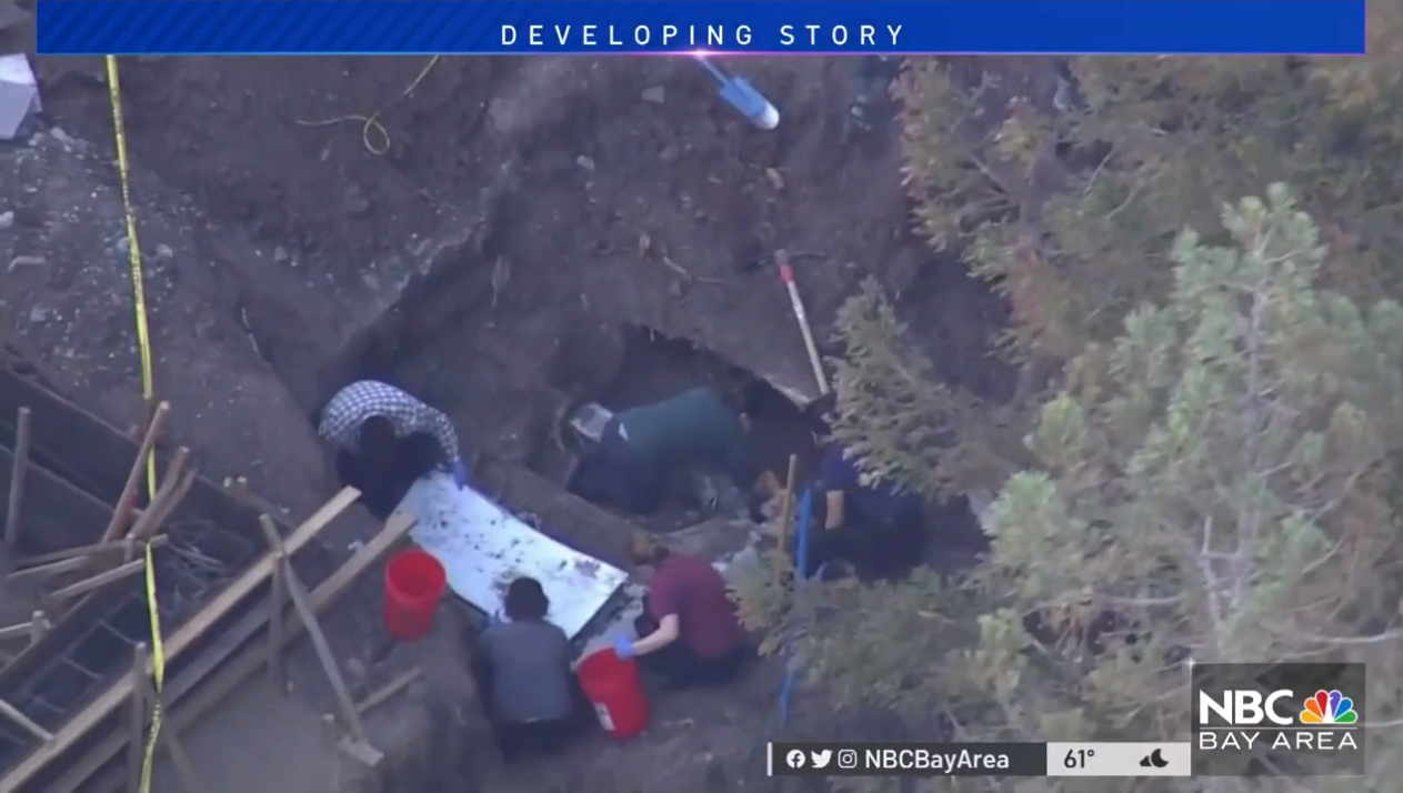 Investigators can be seen digging where a car was found buried in the backyard of a Silicon Valley home on Thursday