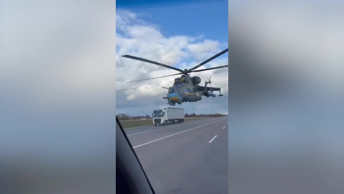 Low-flying attack helicopter narrowly misses vehicles on Ukraine road |  News | Independent TV