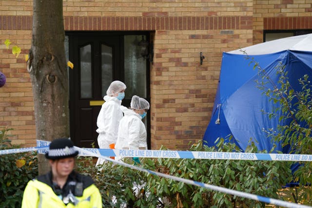 Police in forensic suits in Loxbeare Drive, Furzton, Milton Keynes, where police found the body of missing teenager Leah Croucher (PA)