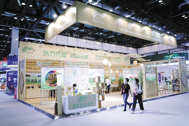 <p>Visitors walk past the booth of the International Bamboo and Rattan Organisation, or Inbar, at the 2022 China International Fair for Trade in Services in Beijing in September </p>