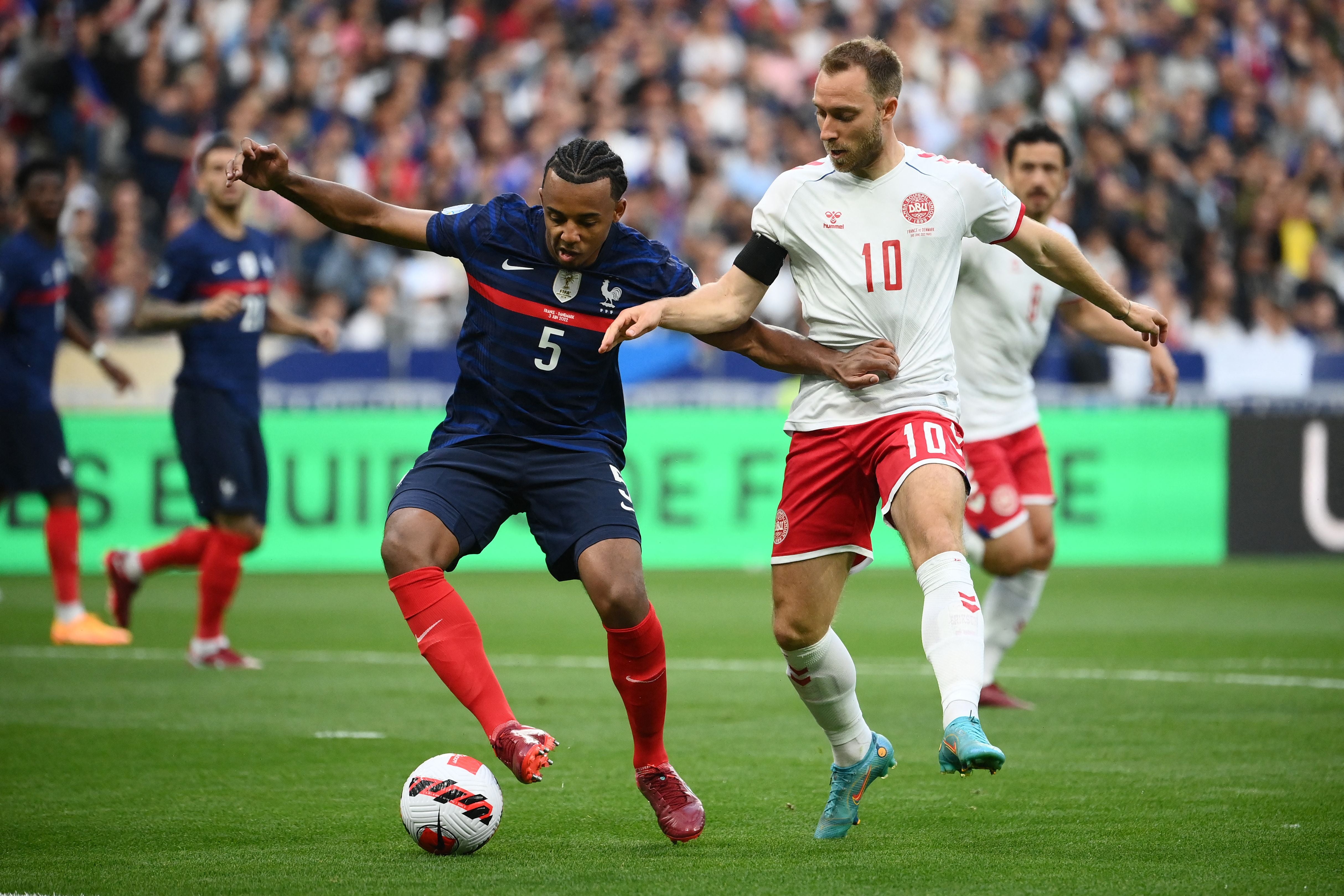France’s Jules Kounde fights for the ball with Denmark’s Christian Eriksen