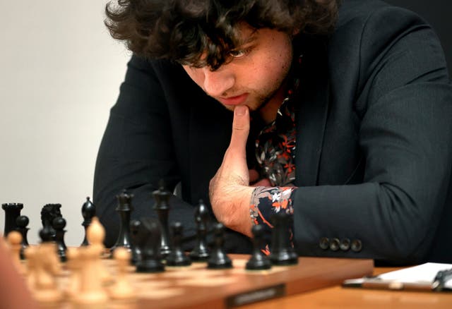 <p>Grandmaster Hans Niemann, 19, studies the board during a match at the US Chess Championship in St Louis</p>