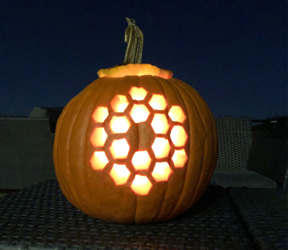 <p>A pumpkin carved in the shape of the iconic, hexagonal primary mirror of the James Webb Space Telescope</p>